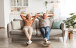 © Prostock-studio - Happy Mature Couple Sitting On Couch Relaxing And Resting At Home, Holding Hands Behind Head, Enjoying Comfort Of Their House. Relaxed Senior Spouses Having Lazy Weekend Indoors. Full Length