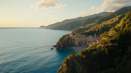 Wall Mural - Scenic coastal view of a quaint village by the sea, surrounded by lush hills at sunset.