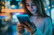 © jambulart - Woman uses phone, night city backdrop.