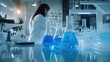 © KenPix - Laboratory scientist, white lab coat, safety goggles, microscope, blue liquid in beaker, scientific research, sterile environment, advanced technology, focused concentration, precise experimentation,