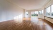 © Rahmat  - stock photo features an empty room with white walls, hardwood floors, and large windows
