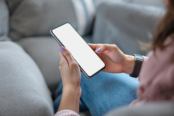 Poster - Blank smartphone screen held by hands with purple nails on a casual background.