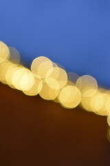 Wall Mural - golden yellow bokeh balls shining bright in the evening sky.