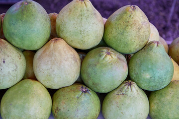 Green pomelo citrus fruit in market