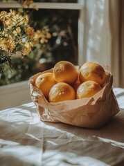 Wall Mural - Fresh, ripe lemons in a brown paper bag resting on a soft, white fabric background