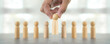 © Jintana - Hand choose wooden person for HR human resources or personal leader training skill or leadership and challenge business team player and organization management teamwork.