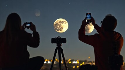 Wall Mural - two people are taking pictures of the moon