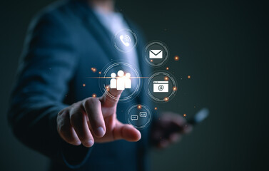 Fototapete - Contact us or Customer support hotline, people connect. Businessman using smartphone and touching on virtual screen contact icons (email, address, live chat, telephone, customer service).