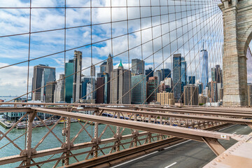 Wall Mural - A view across the upper section of the Brooklyn Bridge towards the financial district in Manhattan, New York, in the fall