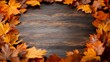 © Raul - Autumn leaves arranged in a circle on a dark wooden surface. The warm, rich colors of the fall foliage create a cozy and inviting atmosphere, perfect for seasonal designs.