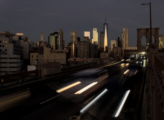 cars driving over the brooklyn bridge from manhattan new york city (long exposure light trails) traf