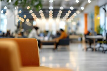 Poster - Modern office space with blurred background, focus on orange chair.