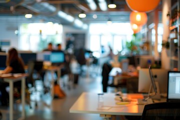 Poster - Blurred image of a busy modern office workspace with computers and desks.