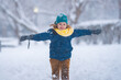 © Volodymyr - Happy Child playing with snow, outdoors during snowfall. Winter child, outdoor portrait. Child play in the snow. Child play in snow park. Winter kid face. Kid teen boy in snow. Winter kids activity.