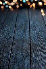 Wall Mural - A black wooden table with a bunch of lights in the background