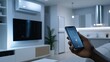 © lililia - Man engages with smart home features through his phone, showcasing a connected modern living space filled with tech devices