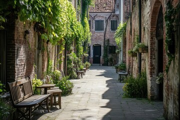 Poster - Sunlit brick alleyway with benches, plants, and ivy-covered walls.