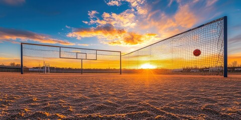 Poster - Sunset over beach volleyball court with ball in net.