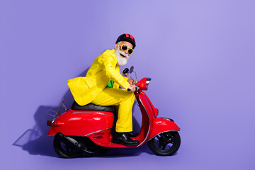 Wall Mural - Profile photo of crazy grandfather wearing stylish costume riding motorcycle store mall center isolated on purple color background