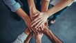 © KHF - A group of people with their hands together, symbolizing unity and collaboration in a business context, emphasizing teamwork and mutual support.