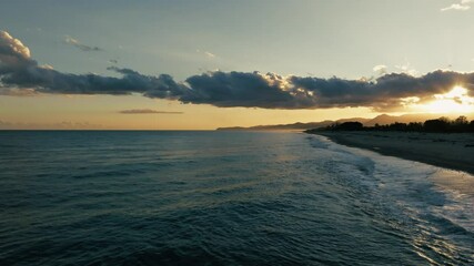 Wall Mural - Ocean Waves Crashing On The Sea At Sunset In Relaxing Winter