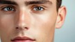 © KHF - Close-up of a handsome young man's face, highlighting a smooth complexion and well-groomed features.