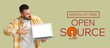 © Pixel-Shot - Banner for Free and Open Source Software Month with young programmer holding laptop
