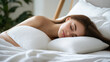 © 沈军 贡 - Beautiful young woman sleeping on a white pillow in her bed at home, a comfortable and relaxing sleep concept