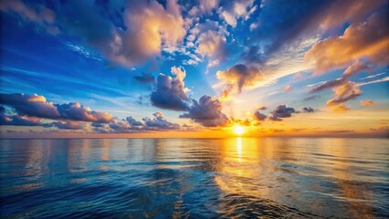 Wall Mural - Softly glowing sunset over calm ocean waters with a vast blue sky and few scattered clouds, sunset, scenery,  sunset, scenery