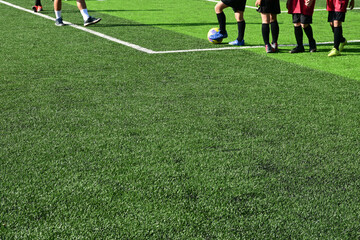 Wall Mural - training of soccer on green grass artificial