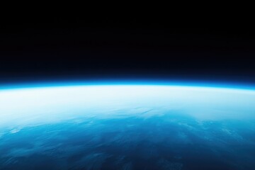 Wall Mural - Blue and black space shot of the Earth. The blue color of the sky is very prominent and the black background is very dark