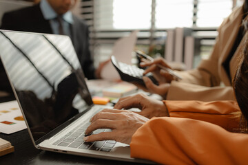 Several employees work together in a company, A group of business people sit together and discuss and exchange ideas about the content of the work, colleagues planning together in the office