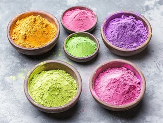 Wall Mural - Row of bowls filled with different colored powders. The bowls are arranged in a row and are of various sizes