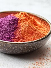 Wall Mural - Bowl of colorful powder with purple and orange colors. The bowl is placed on a white surface