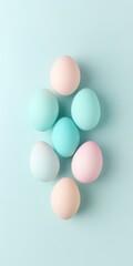 Poster - Pastel-Colored Easter Eggs on Light Blue Background Minimalist Spring Arrangement