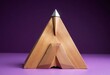 © Nguyen - Wooden pyramid with silver top on purple background