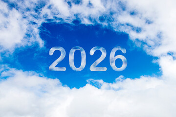 Wall Mural - Sky cloud year 2026. Happy New year concept. 2026 cloud against the blue sky.Year 2020 symbol inscription on a background of blue sky from white smoke of clouds lit by a bright sun