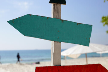 Wall Mural - Wooden sign on the beach