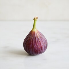 Poster - Ripe fig with soft purple skin resting on a marble surface under natural light