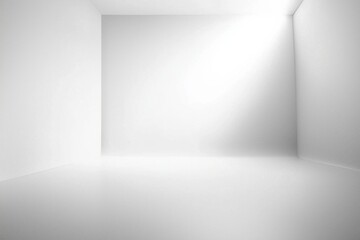 An empty photo studio backdrop with a seamless white gradient, illuminated by softbox lighting 