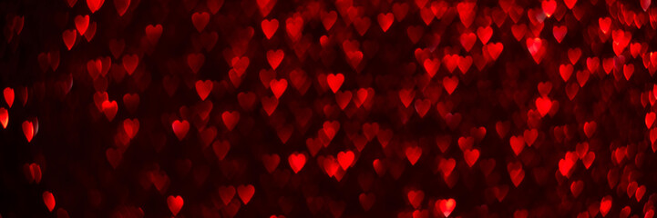 Wall Mural - Red hearts, sparkling glitter bokeh background banner, valentines day abstract defocused texture header.