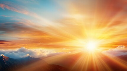 Wall Mural - a bright sun shining through the clouds over a mountain range