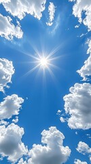 Wall Mural - A bright sun shines through the clouds in a blue sky
