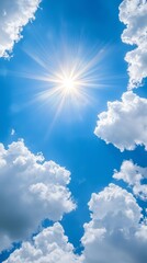 Wall Mural - A bright sun shines through the clouds in a blue sky