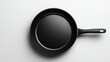 © Rizqiana - Black frying pan on white background, top view, ready for cooking. (1)