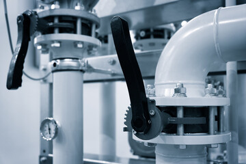 Aufkleber - The gas pipeline is yellow with additional equipment, pipes and a valve to shut off the gas supply. Against the background of blur is an image of gas compressor station
