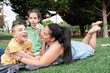 © ADDICTIVE STOCK - Joyful family moment outdoors with disabled children overcoming challenges