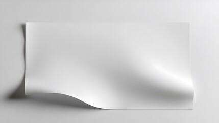 Poster - White Paper Sheet Gently Curving on a Plain Background