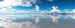 © Fidel - A breathtaking view of the Salar de Uyuni salt flats in Bolivia, with a mirror-like reflection of the sky creating an infinite horizon, Salt flats scene