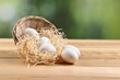 © New Africa - Basket with raw eggs on wooden table, closeup. Space for text